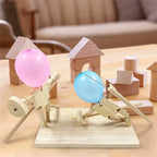 Balloon Fencing Battle Game with pink and blue balloons posed beside wooden building blocks.