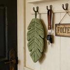Banana Leaf Hand Towel hanging on an entryway hook beside keys