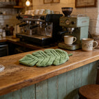 Banana Leaf Hand Towel resting on a rustic kitchen counter