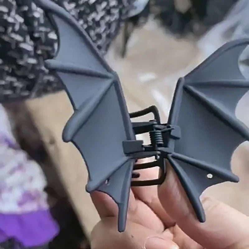 Bat Wing Claw Clip close-up showing the spring hinge and raised details on the black wings.
