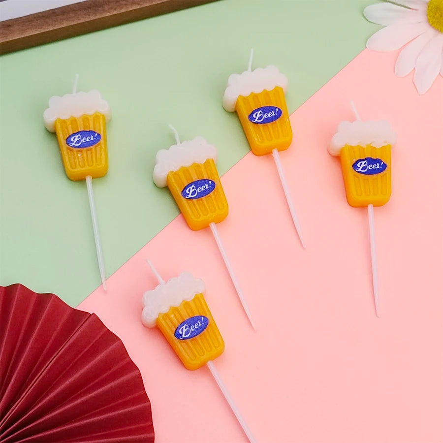 Beer Birthday Candles displayed face up, showing five yellow beer-glass shapes with blue labels and white picks.