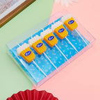 Beer Birthday Candles in a clear tray showing five yellow beer-glass candles with white tops and long picks.