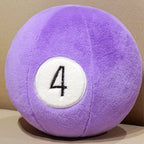 Billiard Ball Plush Set purple number 4 ball resting on a beige seat.