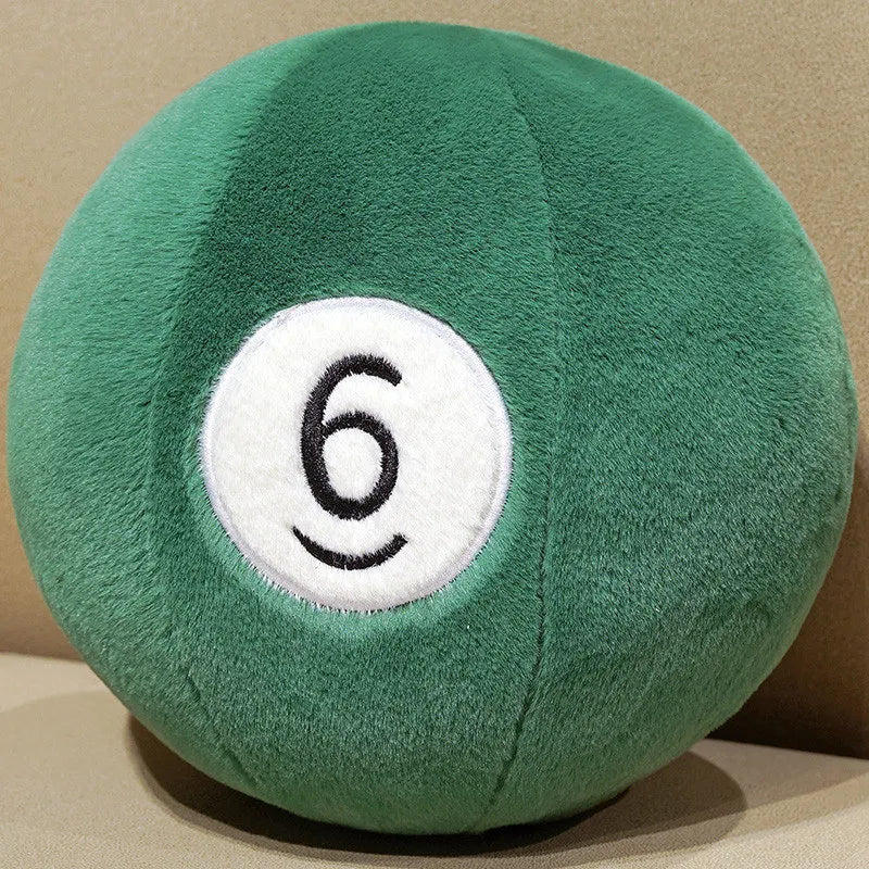 Billiard Ball Plush Set green number 6 ball resting on a beige seat.