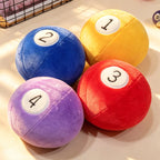 Billiard Ball Plush Set yellow 1, blue 2, red 3, and purple 4 balls grouped in sunlight.
