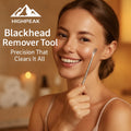 HighPeak Blackhead Remover Tool held by smiling woman with clear skin in warm, softly lit skincare setting.