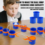 Blow Ball Race Game tabletop demonstration of a player blowing a white ball toward blue cups