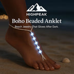 HighPeak Boho Beaded Anklet glowing white on foot at night on sandy beach with seashell nearby