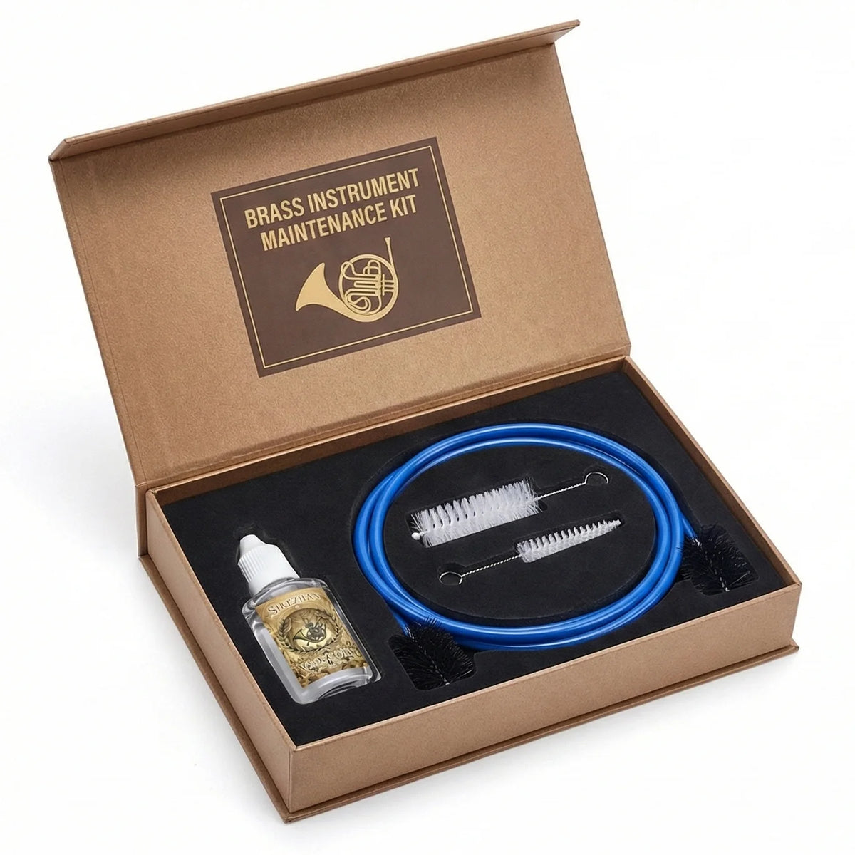 Brass Instrument Cleaning Kit brushes and oil arranged in a decorative box that is not included.