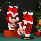 Breakdancing Santa Toy in Handstand and Headstand styles beside Christmas decorations.