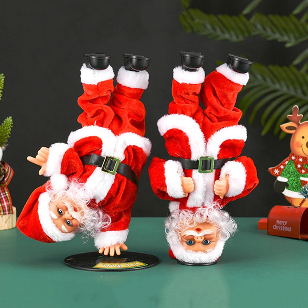 Breakdancing Santa Toy two styles side by side on a green tabletop with festive ornaments.