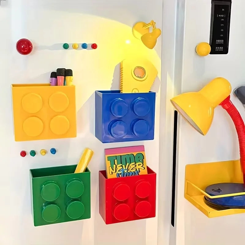 Building Block Storage Bins — Four colorful bins holding stationery and small items beside yellow lighting.