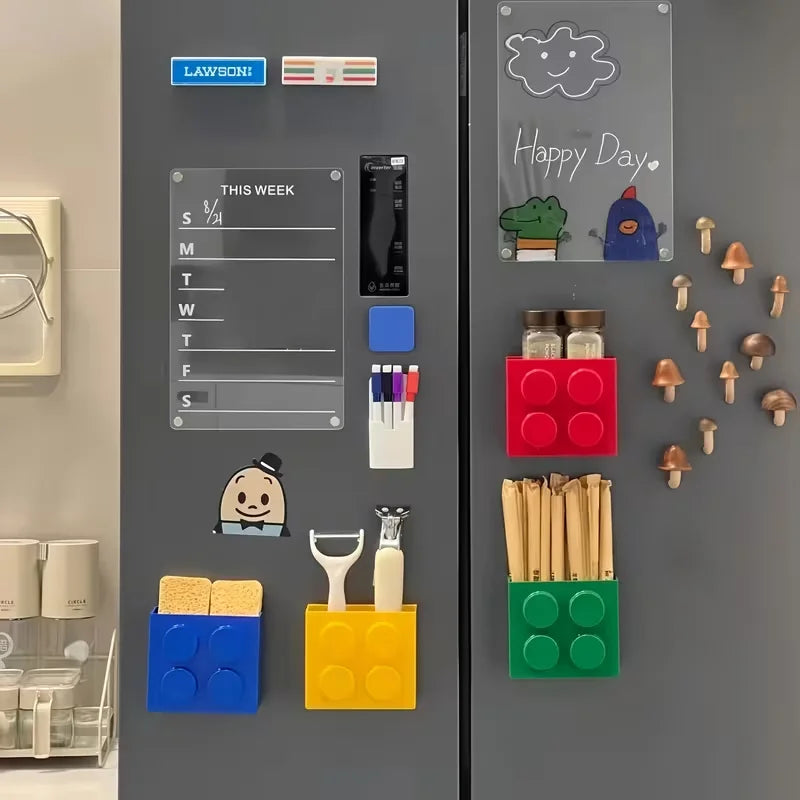 Building Block Storage Bins — Four colors organizing sponges, utensils, packets and small jars on gray fridge doors.