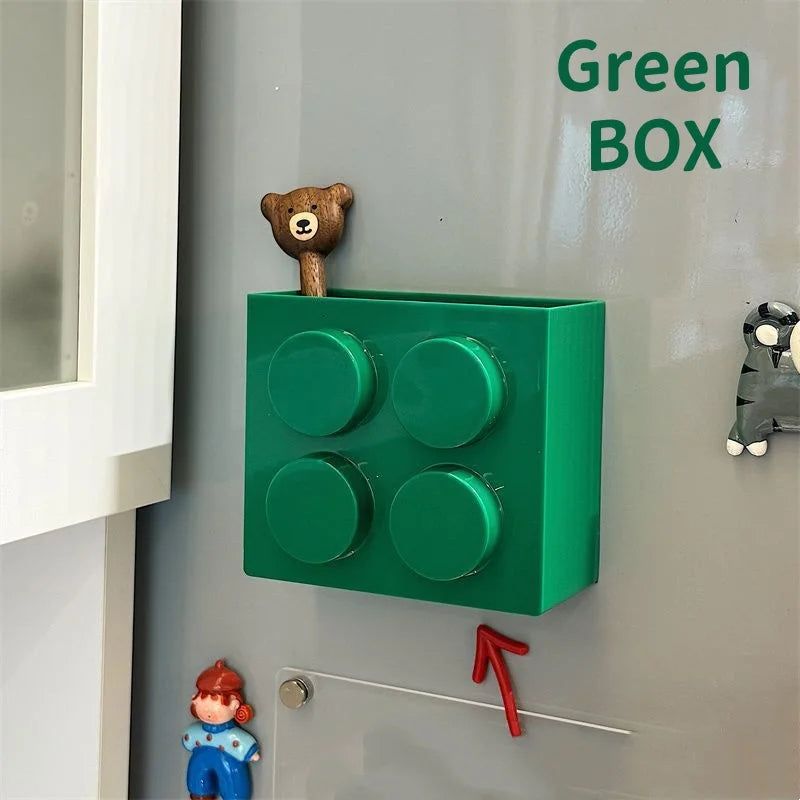 Building Block Storage Bins — Green bin with four raised circles holding a bear-handled utensil.