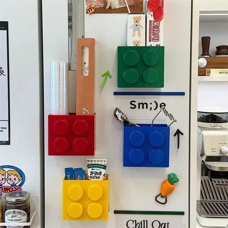 Building Block Storage Bins — Four colors holding kitchen wrap, utensils and packets on a decorated refrigerator.