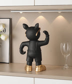 Bulldog Wine Bottle Holder black glass-style figurine from behind beneath cabinet lighting beside a wine glass.