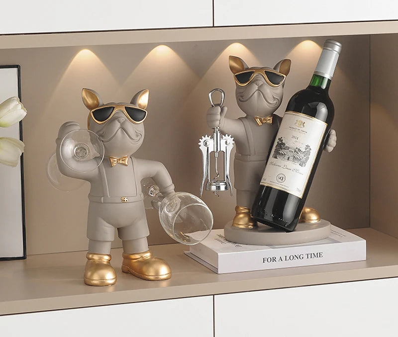 Bulldog Wine Bottle Holder grey glass and bottle styles with gold-tone accents displayed beside a framed print.