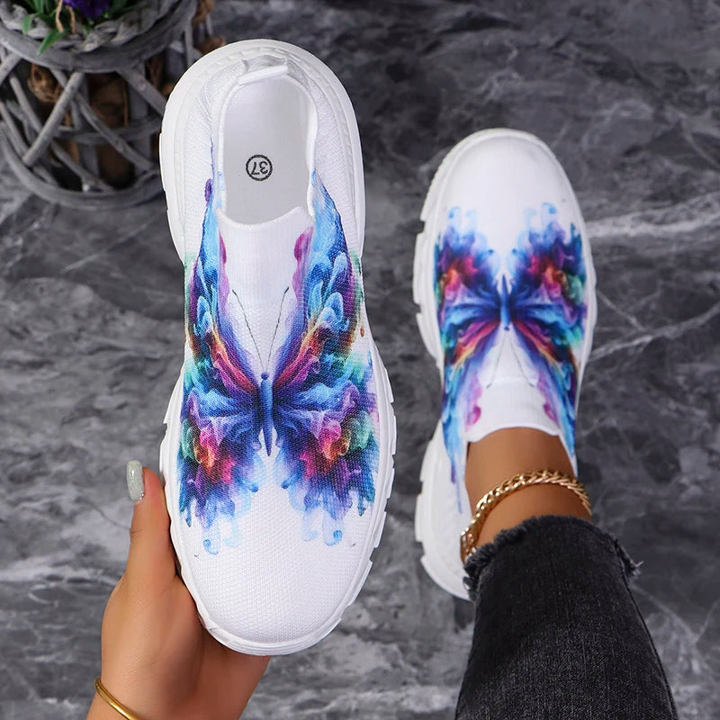 Butterfly Knit Shoes Colorful Butterfly shoe held beside a worn shoe, showing the insole and multicolor wing print.