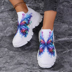 Butterfly Knit Shoes Colorful Butterfly shoes viewed down toward the toes, with pink and blue wing artwork.
