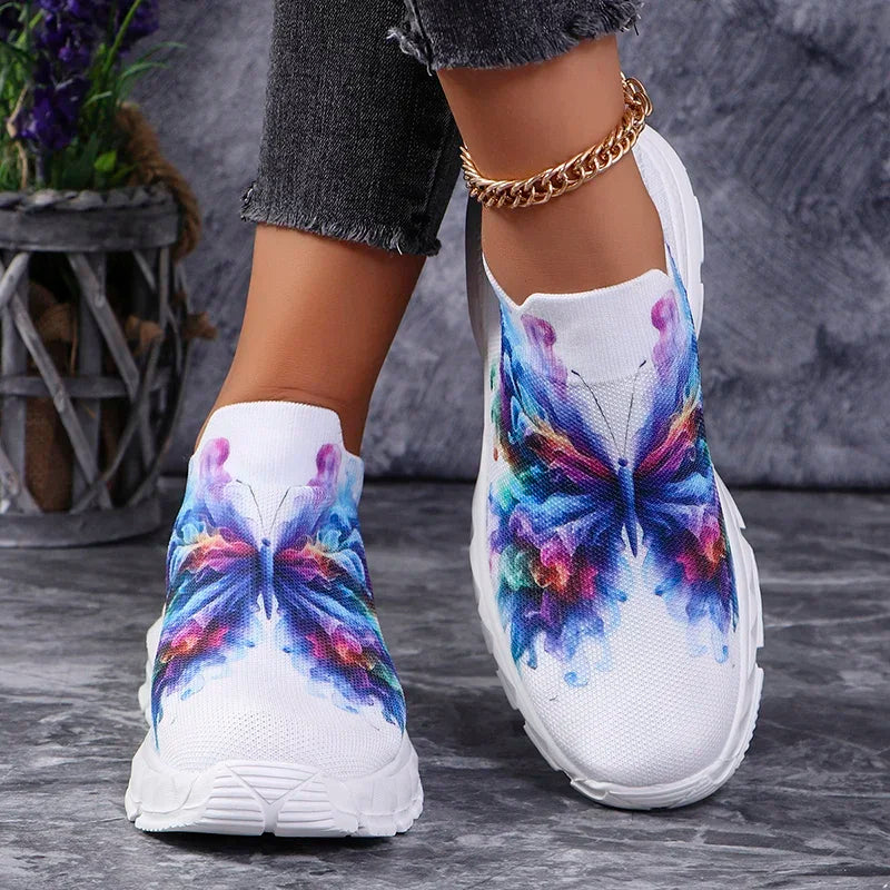 Butterfly Knit Shoes Colorful Butterfly variant shown on feet, with bright pink, blue and yellow details on white uppers.