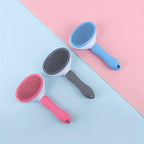 Three FurPop™ Self Cleaning Pet Brushes in pink, gray, and blue with ergonomic grips on a split pastel background, HighPeak.