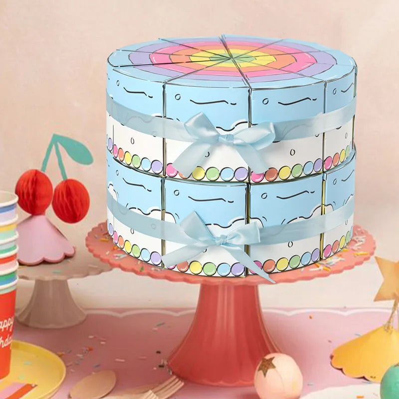 Cake Slice Favor Boxes in blue arranged in two tiers on a festive party cake stand
