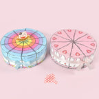 Cake Slice Favor Boxes in blue and pink arranged side by side as full round cake displays