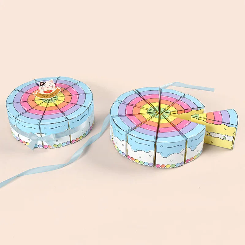 Cake Slice Favor Boxes in blue with coordinating ribbon and one box pulled from the round display