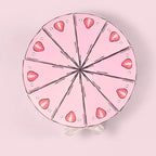 Cake Slice Favor Boxes viewed from above with pink strawberry-pattern slices forming a round cake