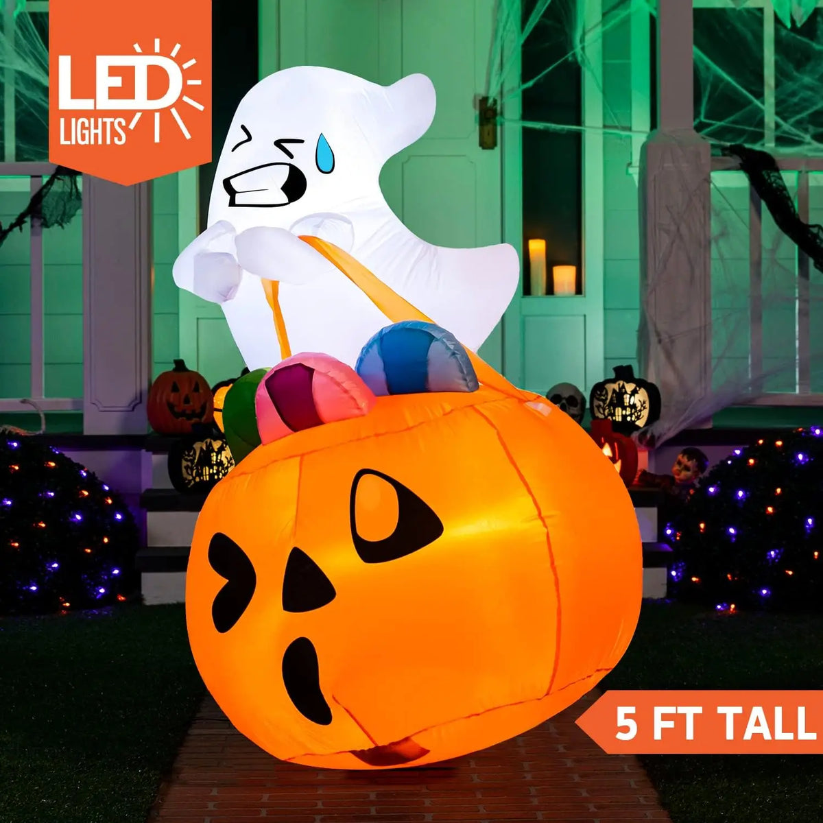 Candy-Carrying Ghost Inflatable glowing at night, with LED lighting and 5-foot height labels.