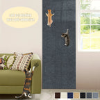 Cat Scratching Wall Mat dark gray variant displayed vertically beside a window and green sofa