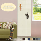 Cat Scratching Wall Mat white variant displayed on a pale wall beside a green sofa
