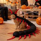 Centipede Pet Costume in Red worn by an orange tabby, with the long body curved across a Halloween party floor.