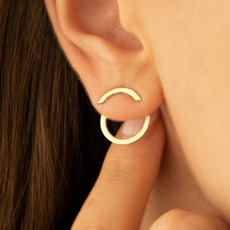 HighPeak Geometric Gold Earrings in gold-plated copper worn on ear, minimalist and bold jewelry style close-up