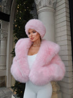 Chérie Faux Fur Coat in pink worn open with full sleeves and a relaxed waist-length silhouette