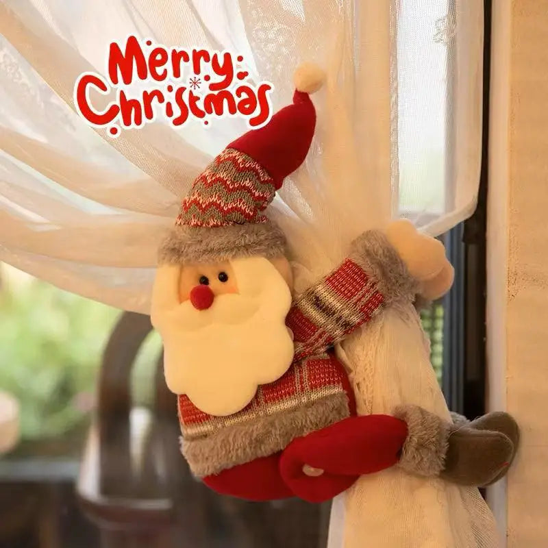 Christmas Chandelier Hugger Santa character wrapped around a curtain beside Merry Christmas text