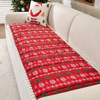Christmas Sofa Pad Cover in red with white snowflakes and green Nordic details on a cream-colored sofa