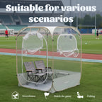 Clear View Bubble Tent on a sports field with open windows and two folding chairs shown inside.