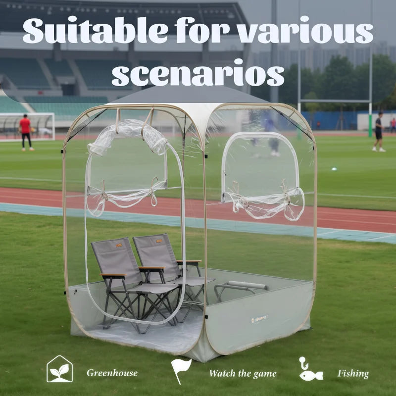 Clear View Bubble Tent on a sports field with open windows and two folding chairs shown inside.