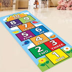 Colorful hopscotch mat displayed diagonally on a light floor, with a 1–10 path, birds, clouds and a sun.