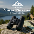 HighPeak Compact Binoculars in black on a rock with outdoor gear and scenic mountain background for hiking use