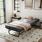 Compact Foldaway Guest Bed with pillows and a throw in a bright guest room beside a nightstand.