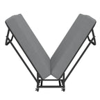 Compact Foldaway Guest Bed partly folded into a V shape, showing the hinged frame and central wheels.