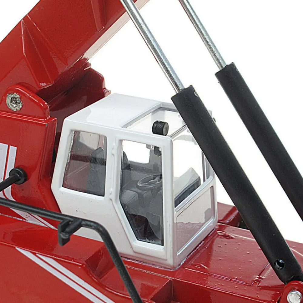 Container Crane Toy close-up of the white cab, steering wheel, black seat and boom support rods