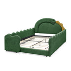 Three-quarter view of green dinosaur bed frame with padded rails and wood slats