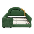 Front view of the green dinosaur bed frame with exposed wood slats on a white background
