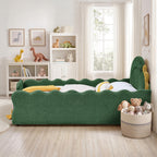 Side view of the green dinosaur bed showing the wavy upholstered rails