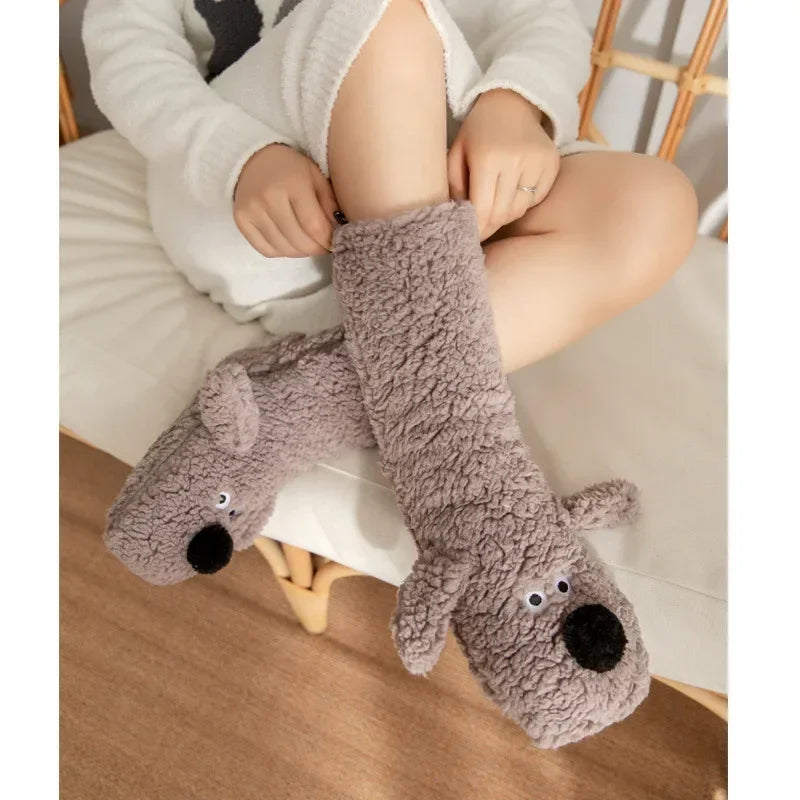 Cozy Dog Ear Socks in a gray style, with a seated wearer gently stretching the cuff