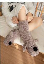 Cozy Dog Ear Socks in a gray style, close-up of the stretched cuff, dog face and matching gray ears