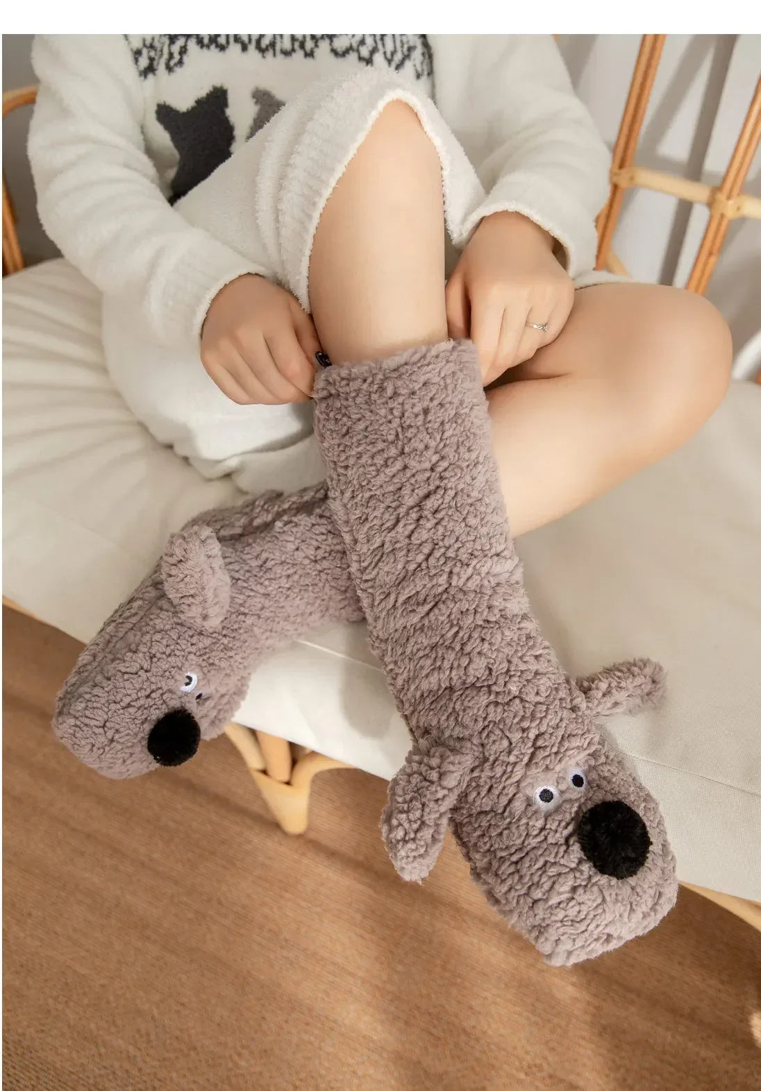 Cozy Dog Ear Socks in a gray style, close-up of the stretched cuff, dog face and matching gray ears
